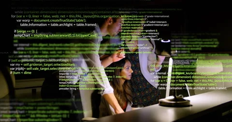 Seated developer starting code edits typing team pointing at animated code Stock Footage 310972866