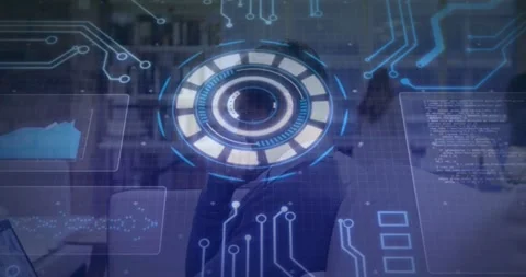 Seated developer viewing screens, raising hand, activating HUD ring to explore Stock Footage 331048541