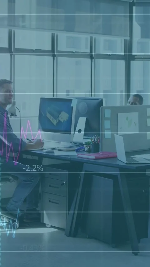 Seated engineer viewing 3D model as graphs rising, noting percent gains, Stock Footage 333109404