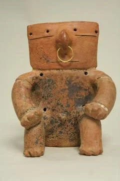 Seated Figure A.D. 7001600 Late Quimbaya This figure shows a person in a se.. Stock Photos