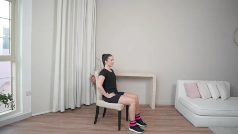 Seated Hip Marching With Weights Stock Footage 314188361