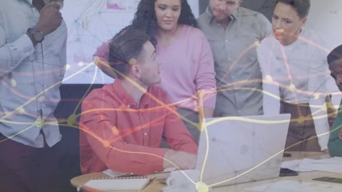 Seated man pointing and typing laptop team leaning in node overlay tracing data Stock Footage 332591983