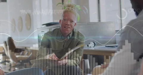 Seated man presenting business data, gesturing pen causing charts sweeping 스톡 동영상 331872604