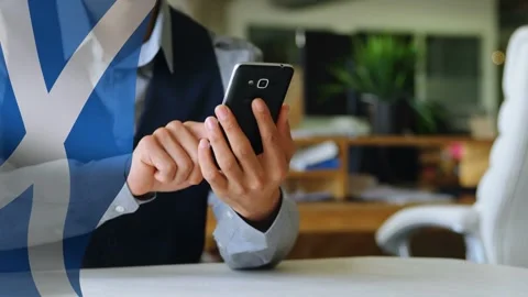 Seated man raising phone tapping scrolling while checking business data blue Stock Footage 334703618