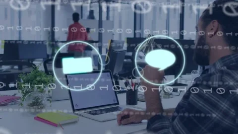 Seated man raising smartphone, gesturing and selecting icons, testing app Stock Footage 334703659