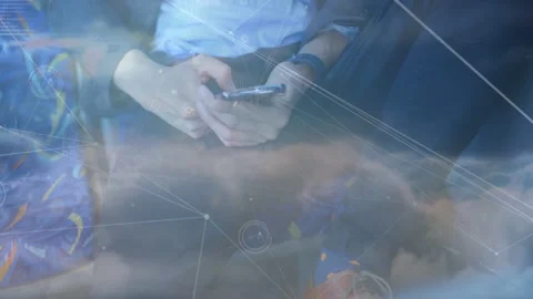 Seated man tapping phone on train, causing cloud network overlays and charts Stock Footage 332613641