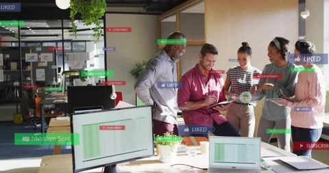 Seated man tapping tablet, team leaning in and sharing phones, social badges Stock-Footage 333902414