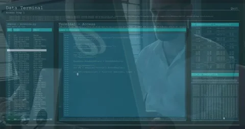 Seated man typing, co-worker observing, Data Terminal populating code and tables Video stock 331006274