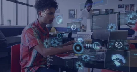 Seated man typing in tech lab, gesturing to laptop and starting chart-code Stock Footage 328396233