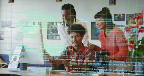 Seated tech dev clicking and typing, starting code overlay while team reviewing Stock Footage 321799823