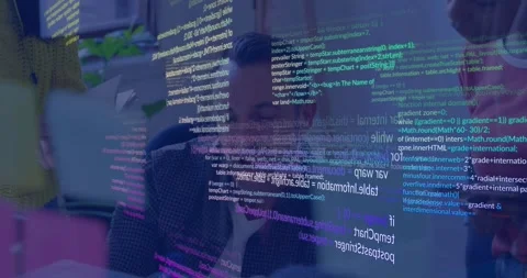 Seated tech lead tapping laptop reviewing code in dev meeting phone scrolling Stock Footage 329899933