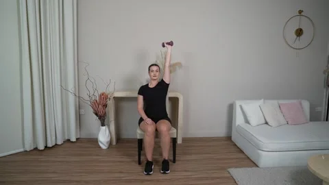 Seated Trunk Strength Rows with Dumbbells Stock Footage 314188796