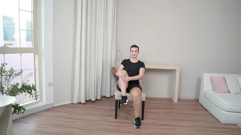 Seated Trunk Stretch Single Knee to Chest Stock Footage 314188840