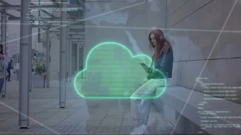Seated woman tapping phone, causing neongreen cloud overlay visualizing data, Stock Footage 334463081