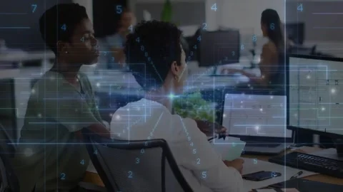 Seated worker using keyboard, peer leaning over and pointing, HUD showing Vídeo Stock 334185387