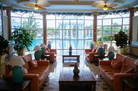 A Seating area with brown leather sofas. Stock Photos