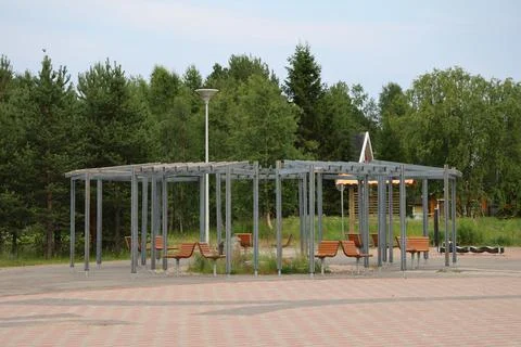 Seating area in a public square in Inari, Finland. The image shows benches an Stock Photos