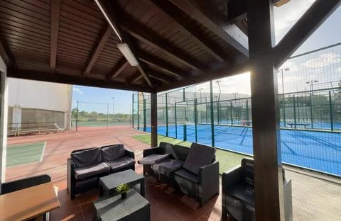Seating area for spectators made with composite deck next to the tennis court Stock Photos
