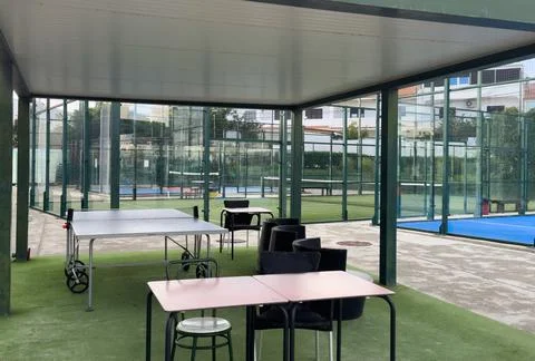 Seating area for spectators made with composite deck next to the tennis court Stock Photos