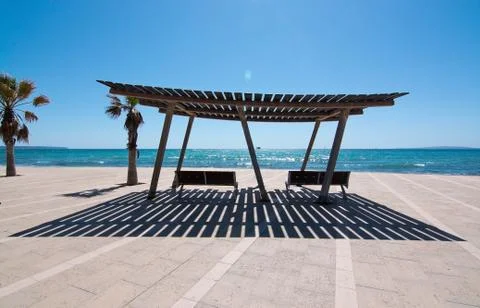 Seating benches with ocean view Stock Photos