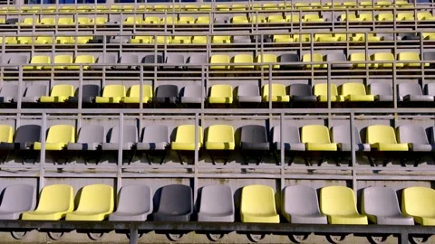 The seating in the empty stadium features an interesting combination of yellow Stock Footage 306060936