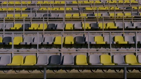 The seating in the empty stadium features an interesting combination of yellow Stock Footage 306060952