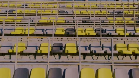 The seating in the empty stadium features an interesting combination of yellow Stock Footage 306061199