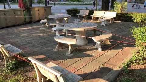 Seats and Picnic Table Sectioned Off at Park Because of Coronavirus Pandemic Stock Footage 130095937