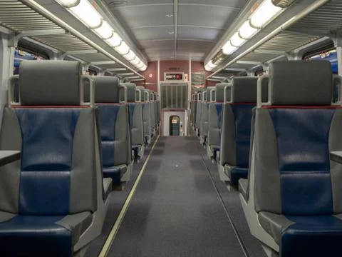 Seats on an empty train cabin ready for departure Stock Photos