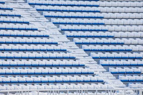 The seats of the stadium stands are covered with snow Foto stock