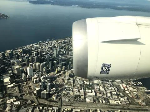 Seattle From Aeroplane With Plane Engine And Sea And Shoreline Stock Photos