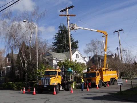 Seattle city light workmen replace an aging utility pole Stock Photos