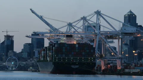 Seattle container port at dusk, as lights come on Video stock 67239965