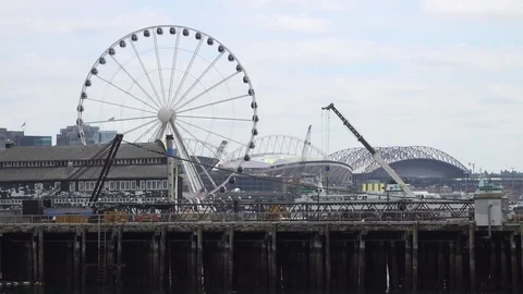 Seattle ferris wheel and crane - 4k Stock Footage 111075862