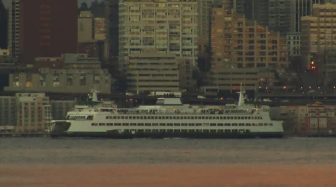 Seattle ferry sails by waterfront Stock Footage