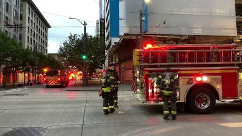 Seattle Firefighters battle fire at 2nd and Pike Stock Footage 197633597