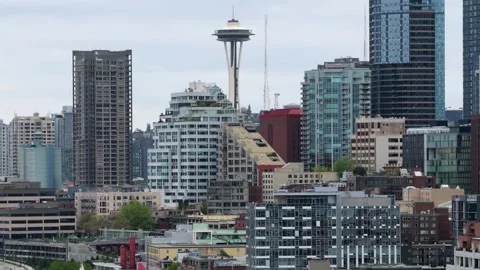 Seattle skyline rises around iconic Space Needle, dense highrise towers and Stock Footage 337746984