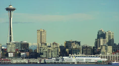 Seattle skyline with Space Needle left in frame, mountains Stock Footage 62840938
