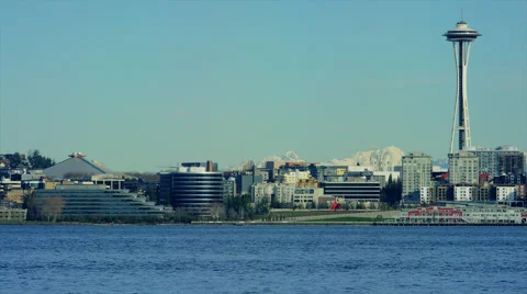 Seattle skyline with Space Needle left in frame, mountains, ferry. Stock Footage 62846192