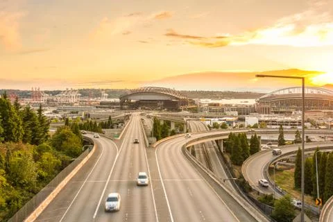 Seattle skylines and Interstate freeways converge with Elliott Bay and the wa Stock Photos