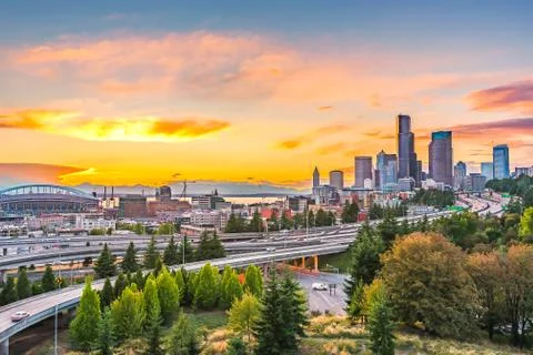 Seattle skylines and Interstate freeways converge with Elliott Bay and the wa Stock Photos