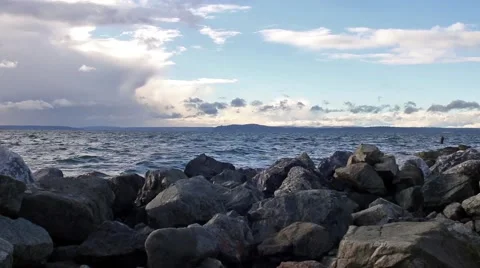 Seattle Sound over Rocks during Evening Washington Video stock 58628677