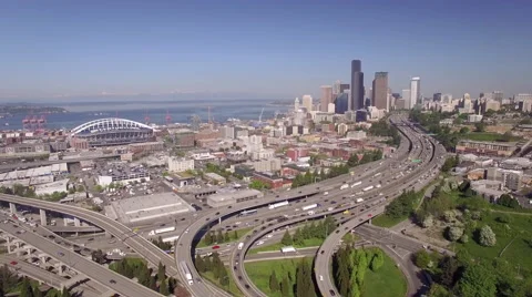Seattle, WA 4-20-16: Rising Aerial of Freeway with Downtown Skyline Stock Footage