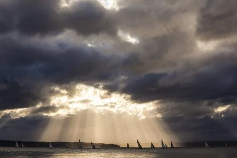 Seattle,United States,Sunlight streaming though storm clouds, Puget Sound. Stock Photos