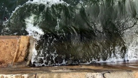 Seawall Wave splash up slow motion Stock Footage 100604439