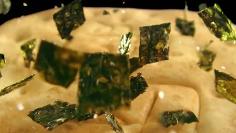 Seaweed falling on biscuit Stock Footage 219465074