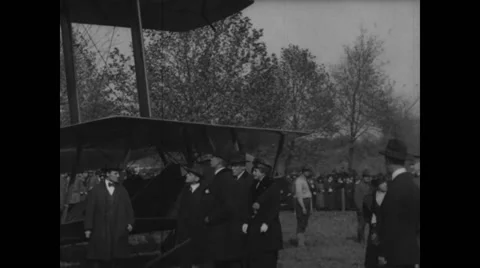 Sec. Newton Baker, Edith Wilson and Gen. March inspecting Handley Page biplane Stock Footage 43325316
