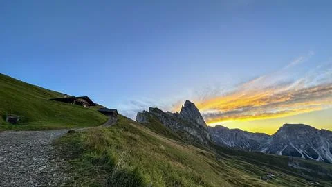 The Seceda in Dolomites stand majestic, an array of green Stock Photos