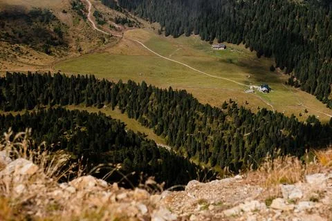 Seceda mountain landscape with alpine huts and winding paths in the Dolomites Stock Photos