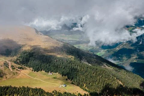 Seceda mountain landscape with clouds and green valleys in the Dolomites, Ita Stock Photos